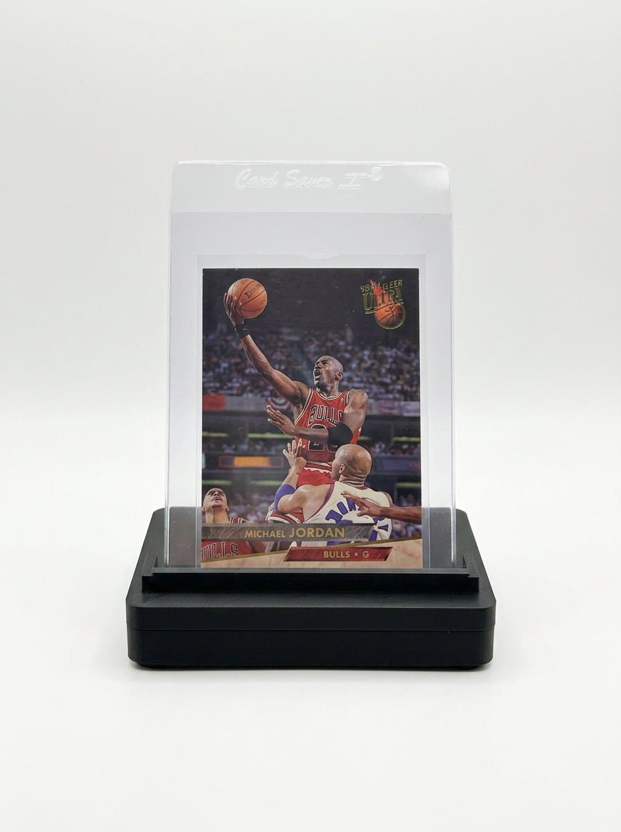 GO-001 holding a Michael Jordan card in a Card Saver I semi-rigid holder