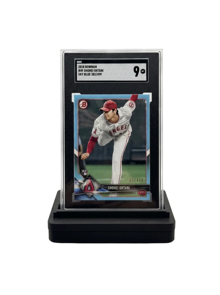 GO-001 holding an SGC-graded 2018 Bowman Shohei Ohtani slab
